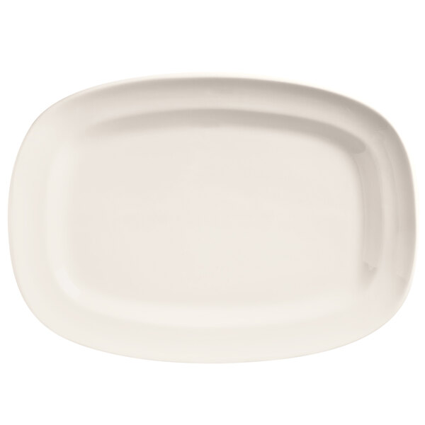 A Libbey Basics bright white porcelain racetrack plate with a white border.