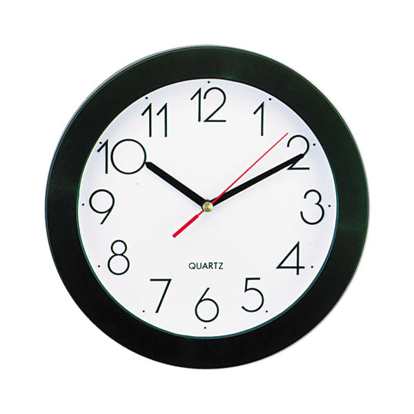 A Universal black and white wall clock with black hands and a white face.