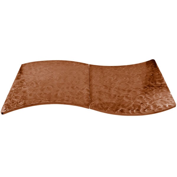 A brown metal Tablecraft serpentine swirl table cover with a curved surface.