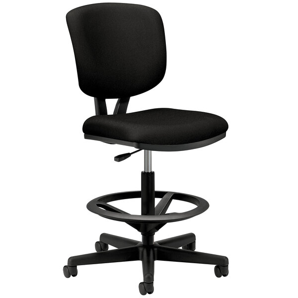 A HON Volt Series black leather task stool with a black seat and back.