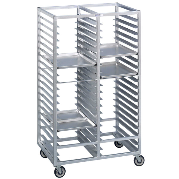 A silver metal Channel 420A sheet pan rack with shelves on wheels.