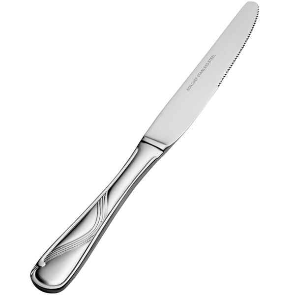 A close-up of a Bon Chef stainless steel dinner knife with a solid handle.