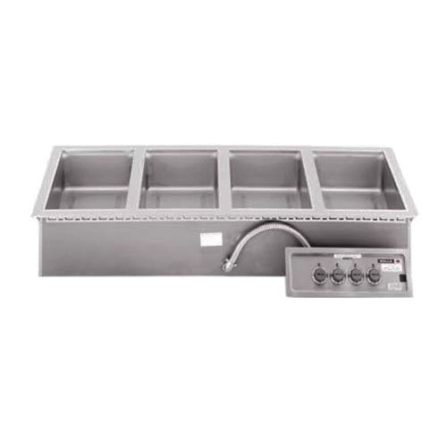 A Wells drop-in hot food well with four compartments on a counter.