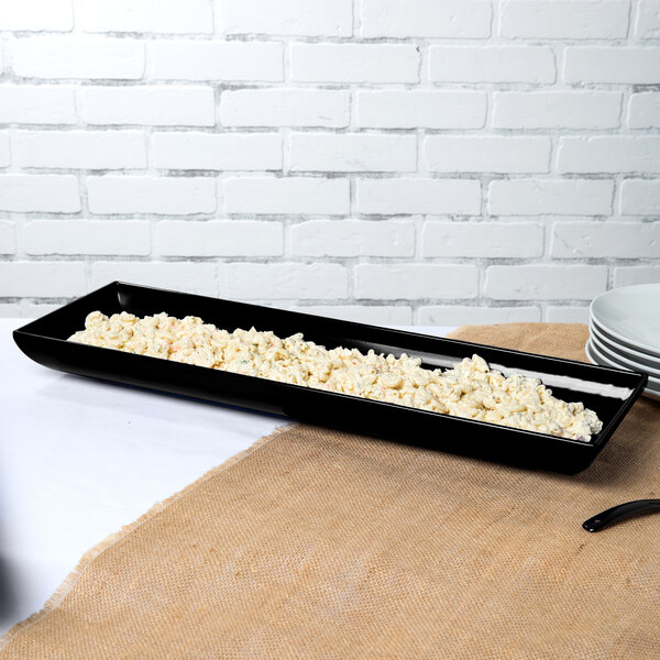 A black Tablecraft rectangular tray with food on it.