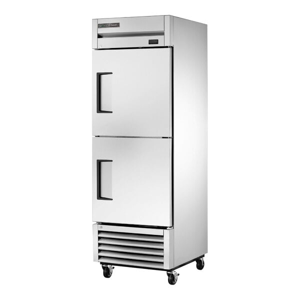 A stainless steel True reach-in freezer with solid top and bottom doors.