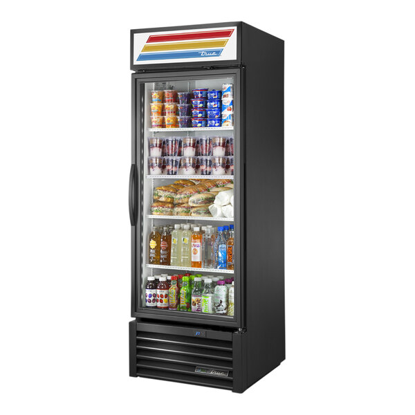 A black True glass door refrigerator with shelves full of drinks.