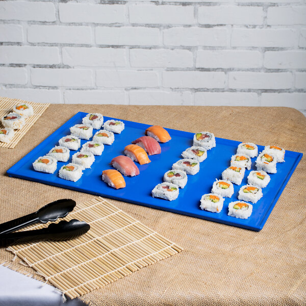 A blue Tablecraft rectangular cooling platter with sushi on it.
