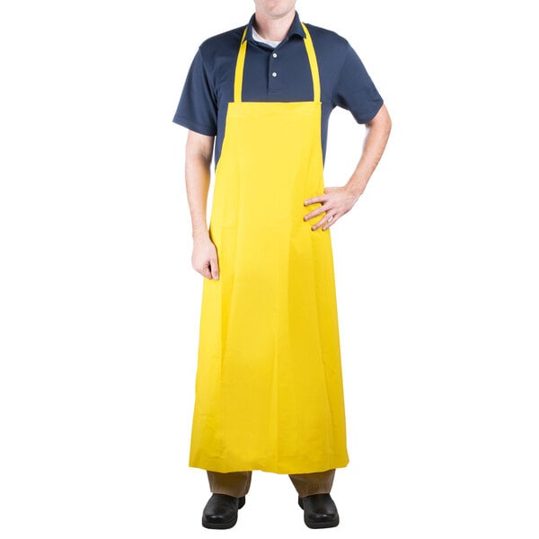 A person wearing a yellow Cordova polyester apron.