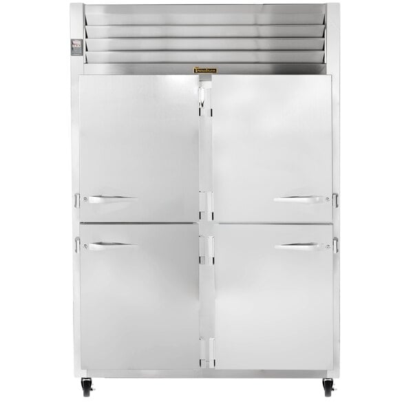 A white Traulsen reach-in refrigerator with silver handles on two doors.
