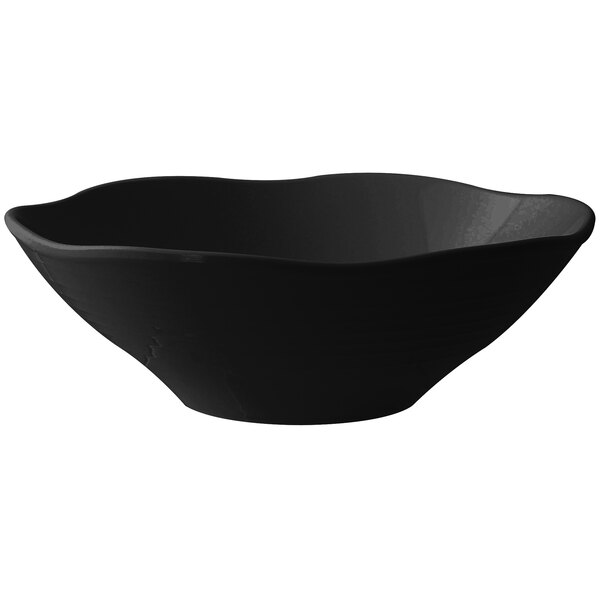 A black Thunder Group melamine bowl with a wavy edge.