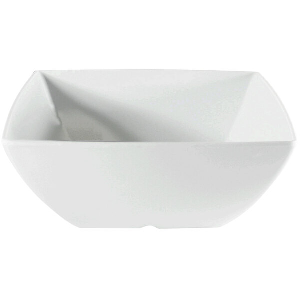 A close-up of a white square melamine bowl with a small handle.