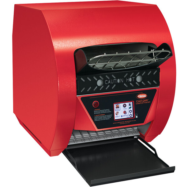 A red Hatco Toast-Qwik conveyor toaster with a black panel.