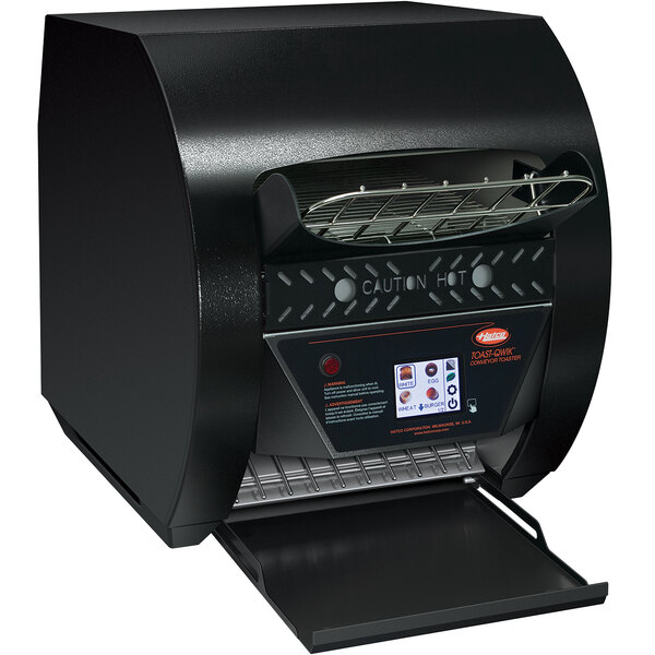 A black Hatco conveyor toaster with a digital display and lid open.
