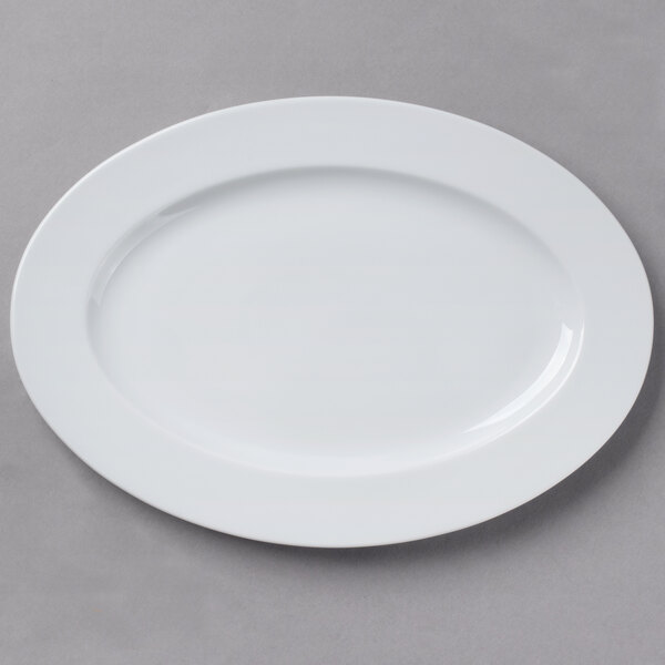 A Schonwald white porcelain oval platter on a gray surface.