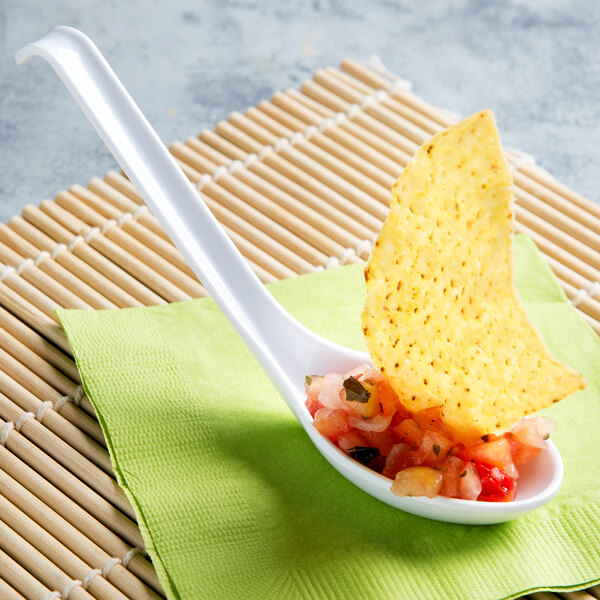 A Thunder Group white melamine Asian soup spoon with salsa and a tortilla chip.