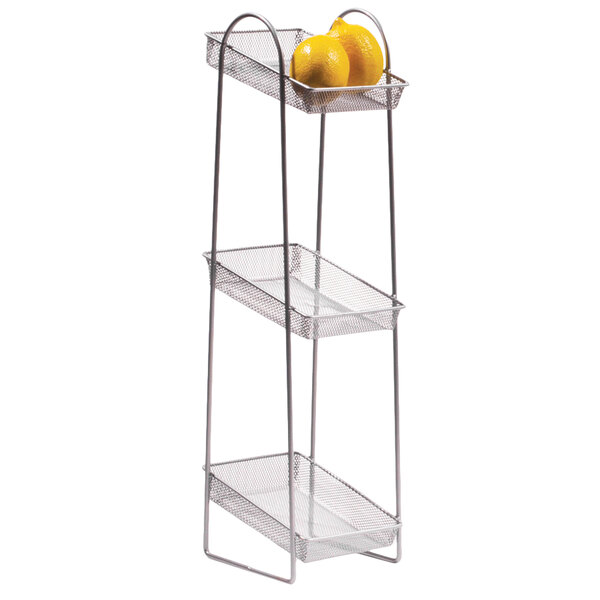 A Clipper Mill 3-tier wire basket stand with lemons on it.