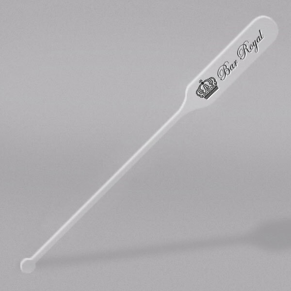 A clear plastic paddle stirrer with a crown on it.