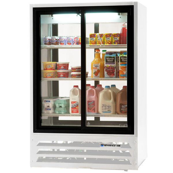 A Beverage-Air white glass door refrigerator with drinks and milk inside.