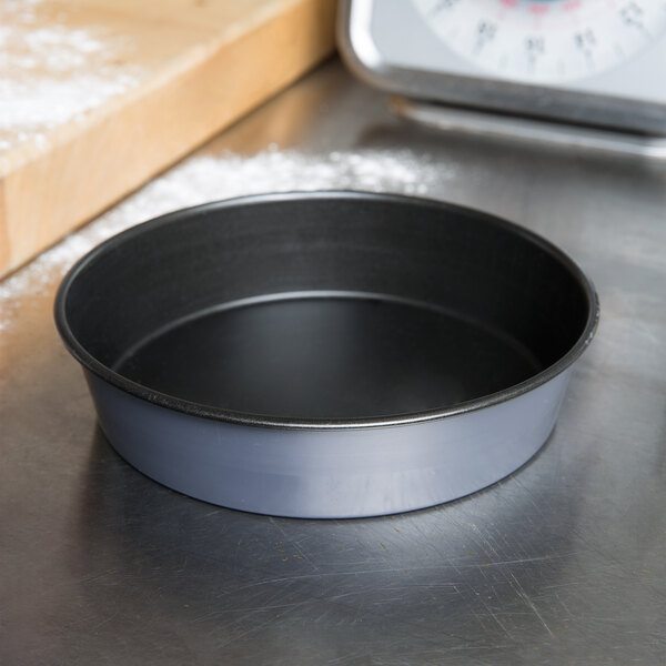 A Matfer Bourgeat round non-stick cake pan on a counter.
