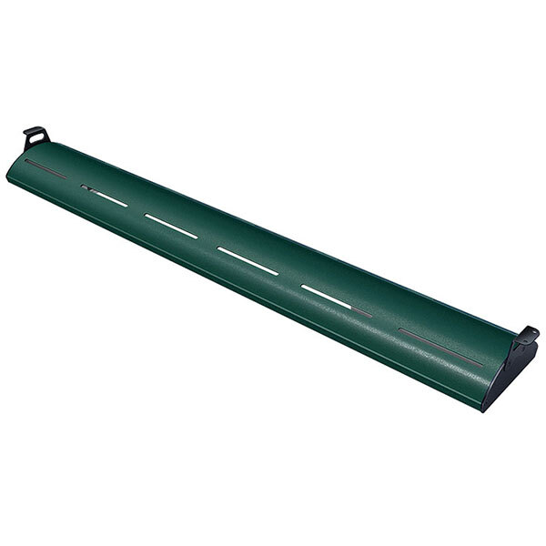 A Hunter Green curved display light with warm lighting on a green metal shelf.