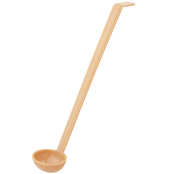 A plastic Cambro beige ladle with a long handle.