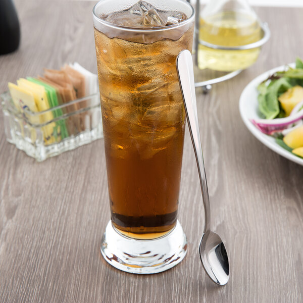 A glass of iced tea with a Libbey stainless steel iced tea spoon.