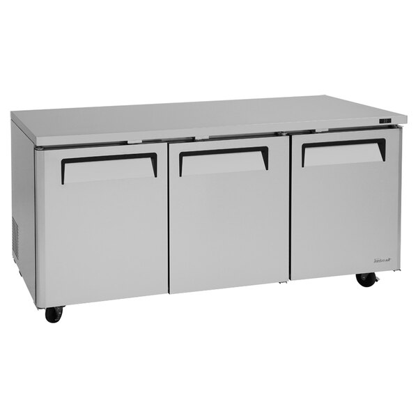 A stainless steel Turbo Air undercounter refrigerator with three drawers.