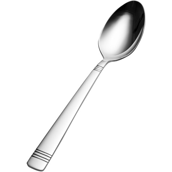 A close-up of a silver Bon Chef serving spoon with a black and white handle.