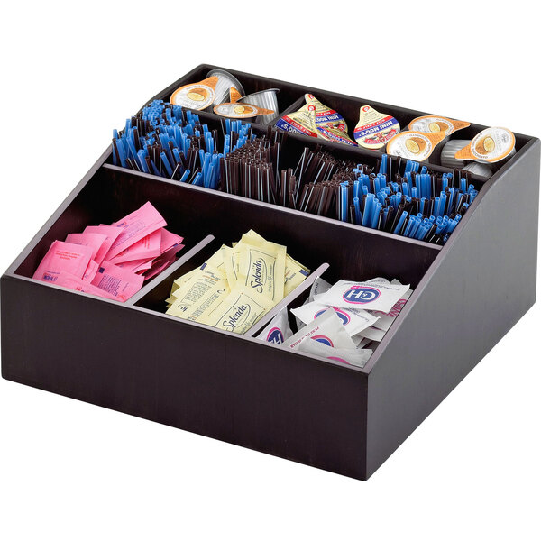 A black wooden Cal-Mil coffee condiment organizer with different condiments and straws.