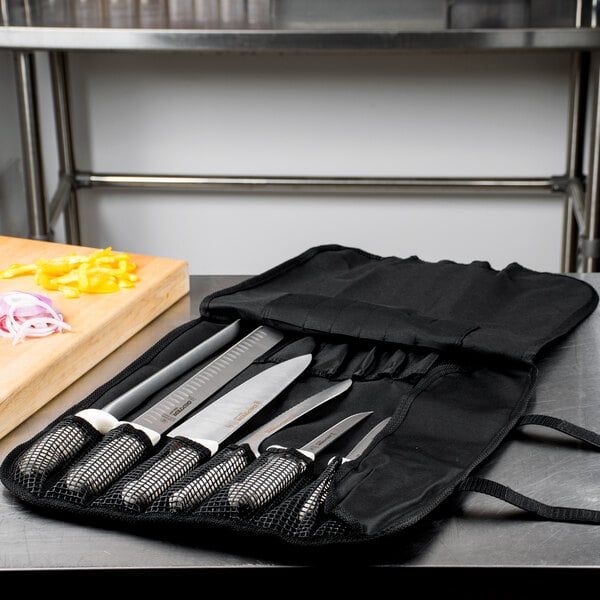 A Dexter-Russell Sani-Safe 7-piece cutlery set in a case.