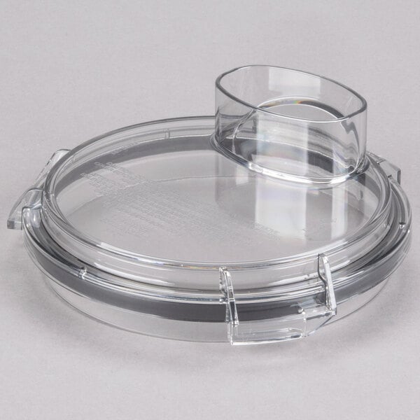 A clear plastic bowl cover with a curved edge.