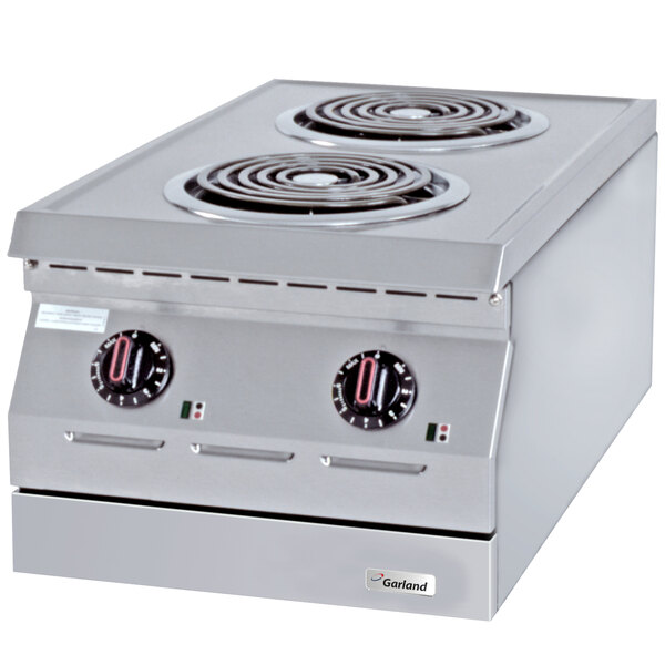 A stainless steel Garland countertop hot plate with two open burners.