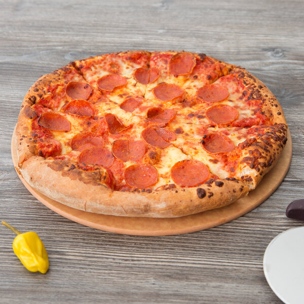 A pepperoni pizza on an Epicurean wood pizza board.