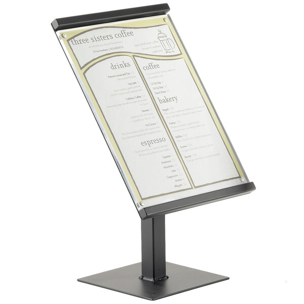 A black metal Cal-Mil menu board stand with white paper on it.
