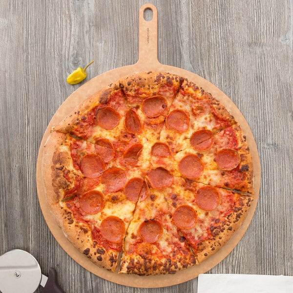 An Epicurean Richlite wood pizza board with a pepperoni pizza on it.