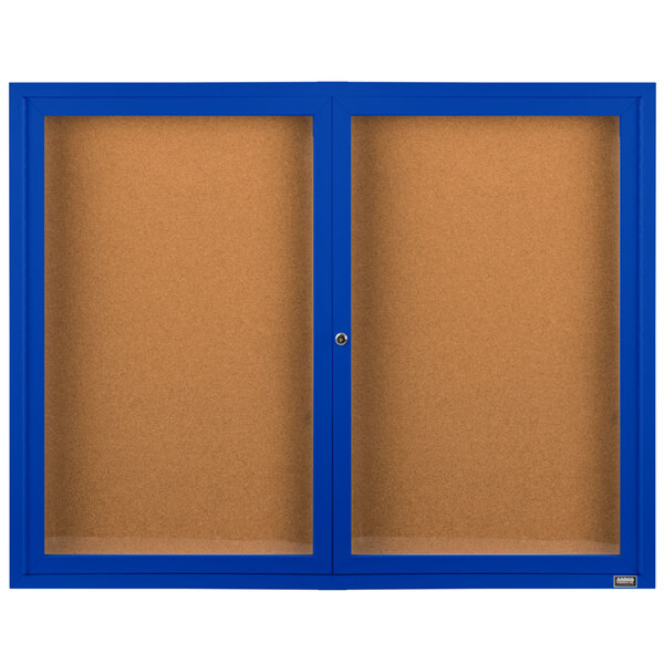 An Aarco blue enclosed bulletin board cabinet with cork boards behind two doors.