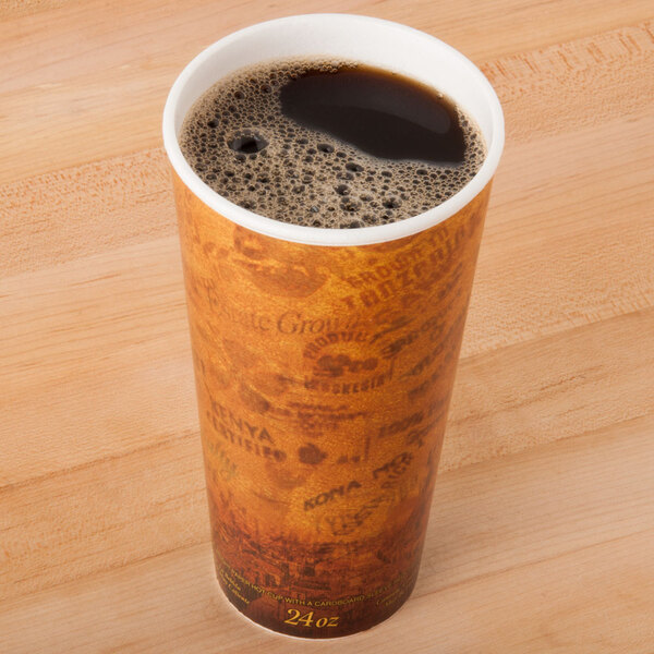 A Dart Fusion Escape foam coffee cup filled with black coffee on a counter.