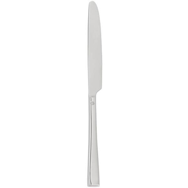 A silver Chef & Sommelier dinner knife with black lines on the handle.