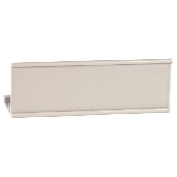 A white rectangular object with a clip on a white background.