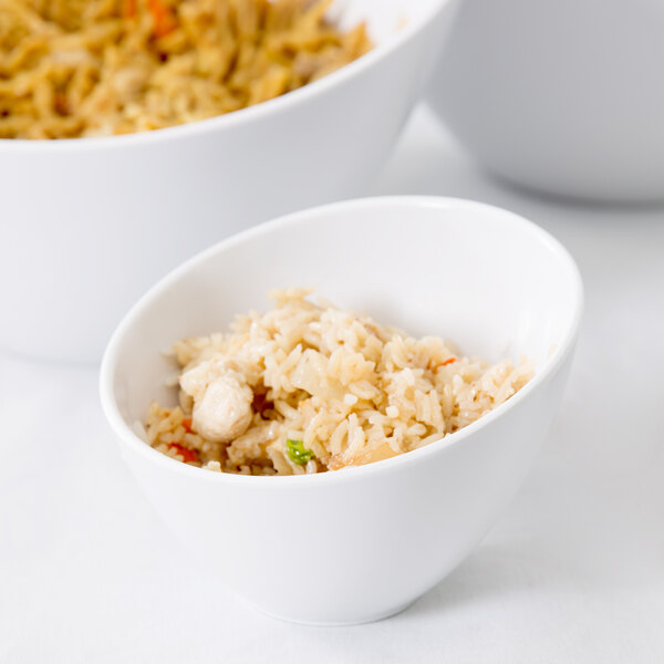 An American Metalcraft white melamine bowl filled with rice and chicken.