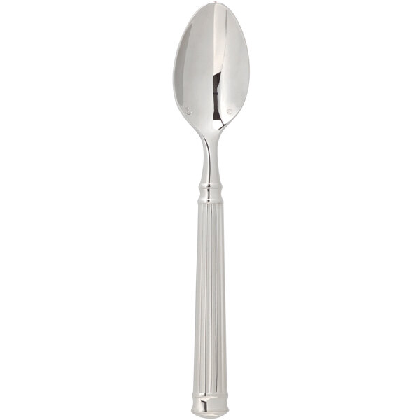 A close up of a Chef & Sommelier stainless steel teaspoon with a fluted handle.