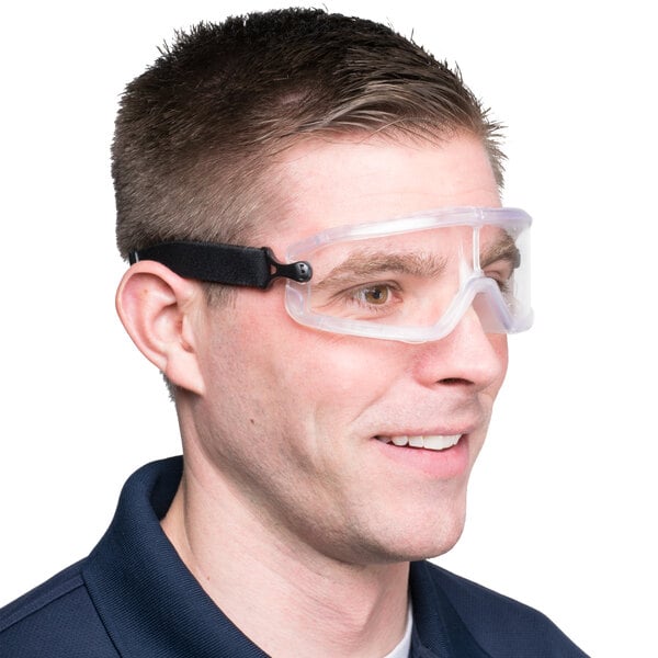 A man wearing Cordova Anti Fog Dust / Splash safety glasses with clear plastic lenses.