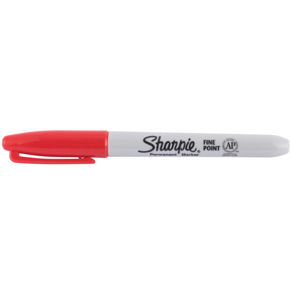 A red Sharpie permanent marker with a white cap and tip.