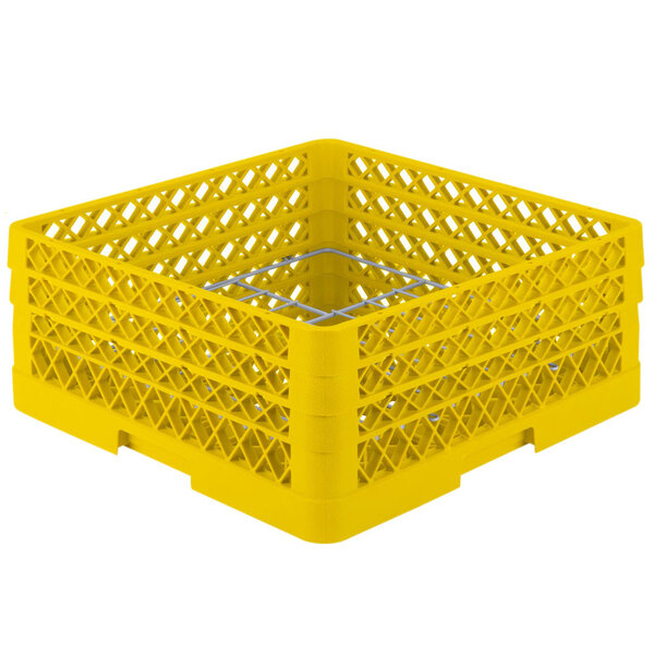 A yellow plastic Vollrath Traex Plate Crate with square compartments.
