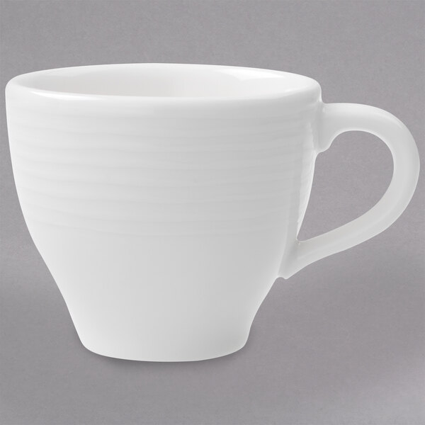 A Villeroy & Boch white porcelain coffee cup with a handle.