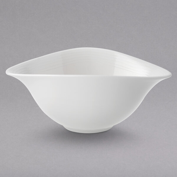 A Villeroy & Boch white porcelain bowl with a curved edge.