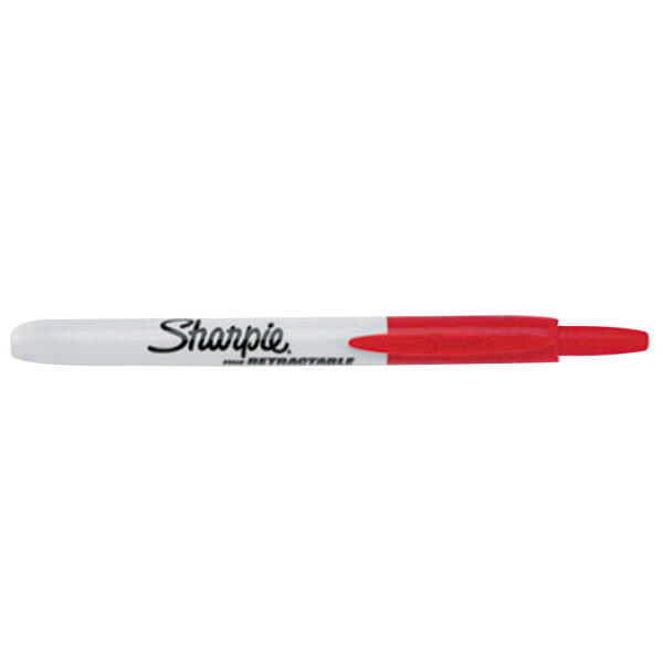A close-up of a red and white Sharpie 32702 Fine Point Retractable Permanent Marker with the word Sharpie on it.