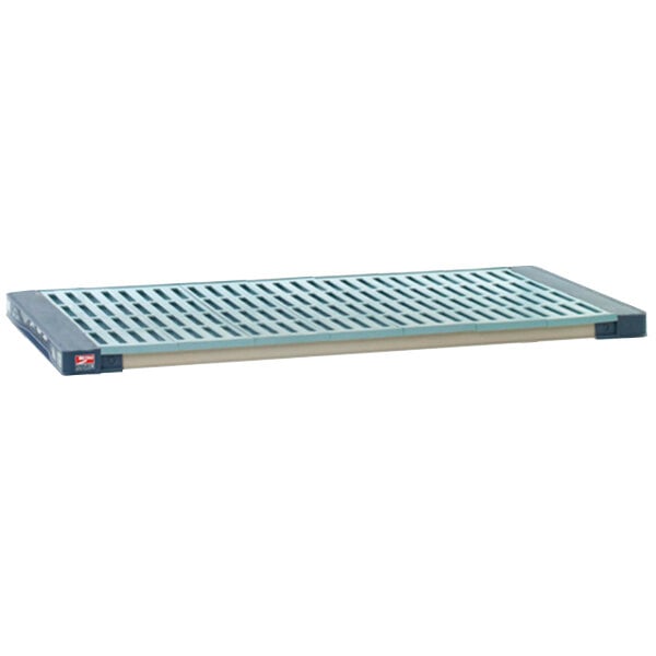 A MetroMax metal shelf with a blue grid mat.