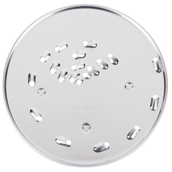 A Waring grating / shredding disc, a circular metal plate with holes in it.