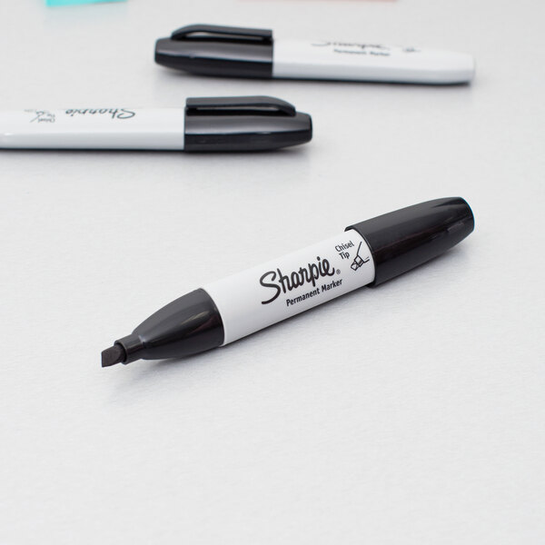 A close up of a Sharpie black chisel tip permanent marker.